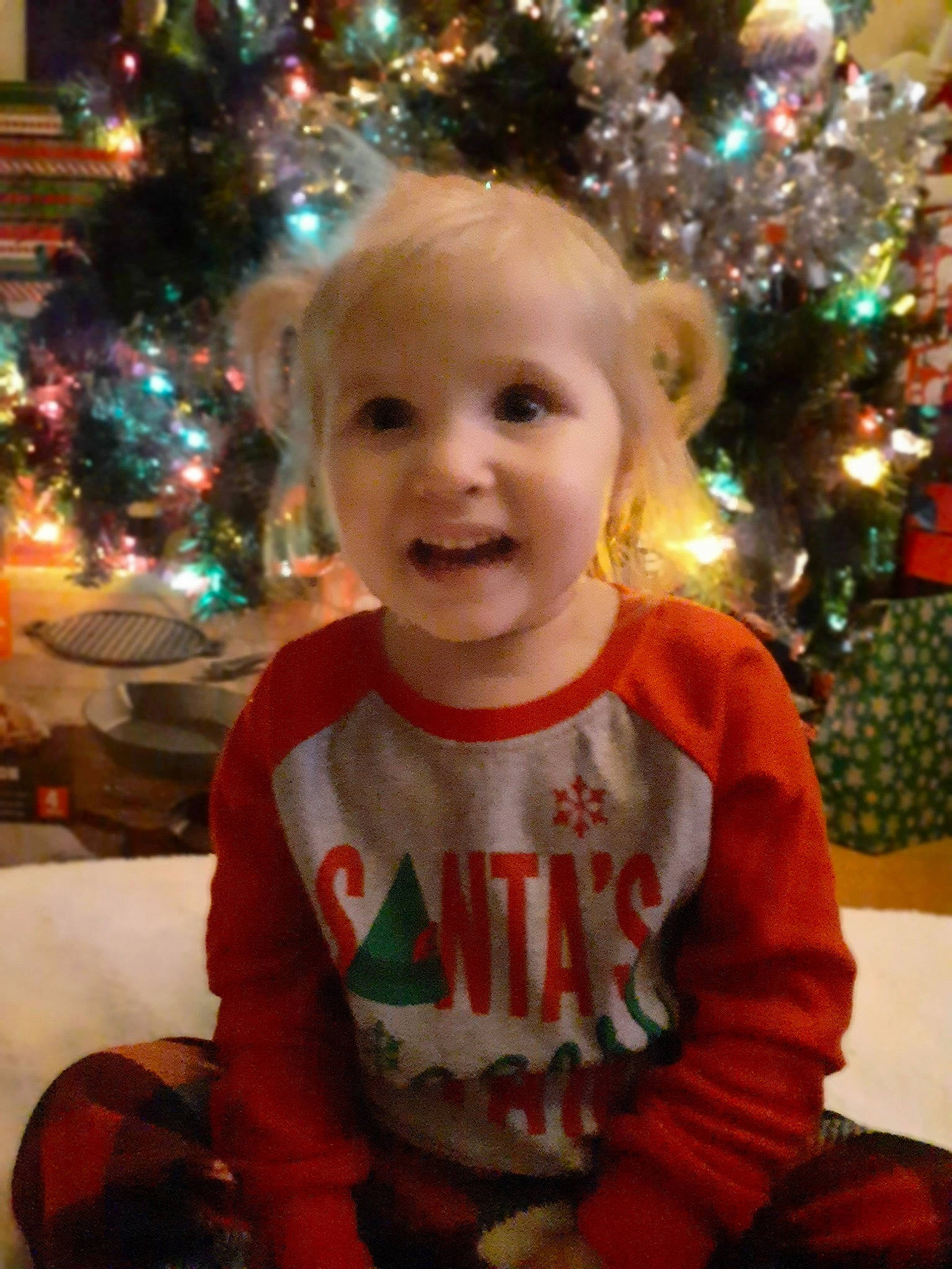 Brealynn is registered to the contest to win money with this photo: child, christmas, christmas_decoration, christmas_eve, christmas_lights, christmas_ornament, christmas_tree, event, fir, happy, holiday, interior_design, person, smile, toddler, tree