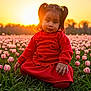 toddler, child, girl, red_clothing, tulip_field, flowers, sunset, nature, outdoor, grass, pigtails, portrait, sunlight, flower_bed, greenery, cute, peaceful, scenic, young_child, falling_sun