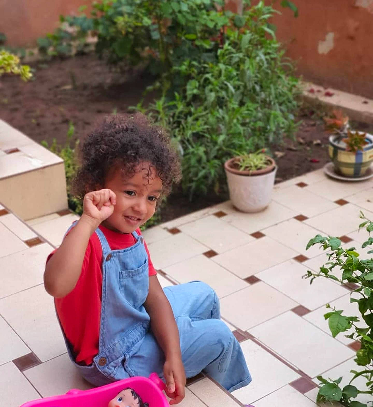 Rihanna joined the competition — help win amazing prizes! baby_toddler_clothing, child, flooring, flowerpot, garden, grass, happy, houseplant, joy, leisure, morning, person, photograph, plant, shrub, sitting, smile, snapshot, spring, t_shirt