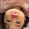 baby, blanket, child, cloud_pattern, cozy, cute, expression, face, fleece, head, indoors, infant, lying_down, pink_clothing, portrait, pout, skin, soft, warm, young_child