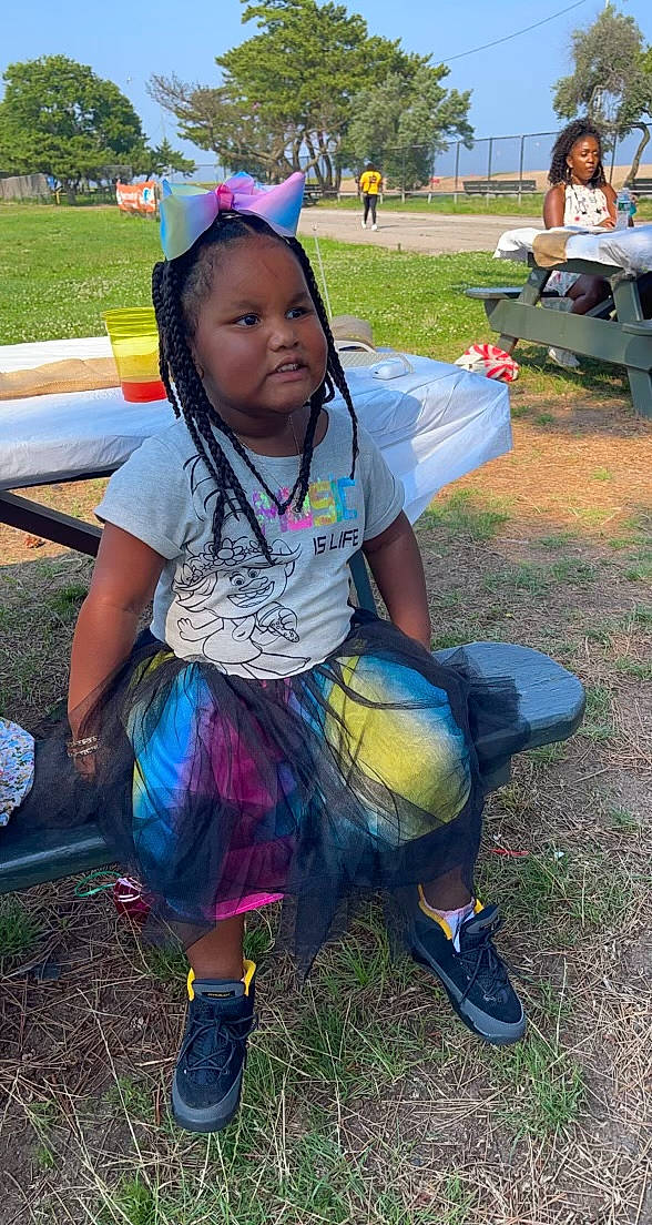 Zendaya joined the competition — help win amazing prizes! bench, boot, chair, child, event, fun, grass, happy, leisure, luggage_and_bags, person, personal_protective_equipment, plant, play, recreation, sandal, shoe, sitting, soil, t_shirt