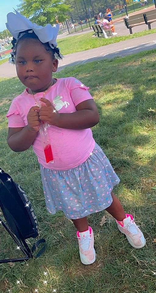 Zendaya is registered to the contest to win money with this photo: baseball_cap, beauty, cap, child, fun, grass, green, hairstyle, happy, hat, leisure, luggage_and_bags, magenta, person, photograph, pink, recreation, sandal, snapshot, summer