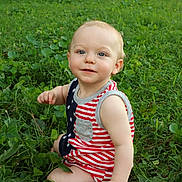 Oaklee joined the competition — help win amazing prizes! toddler, child, grass, outdoor, baby, sitting, smiling, cute, greenery, nature, portrait, young_child, casual_clothing, summer, daylight, innocent, happy, person, face, eyes