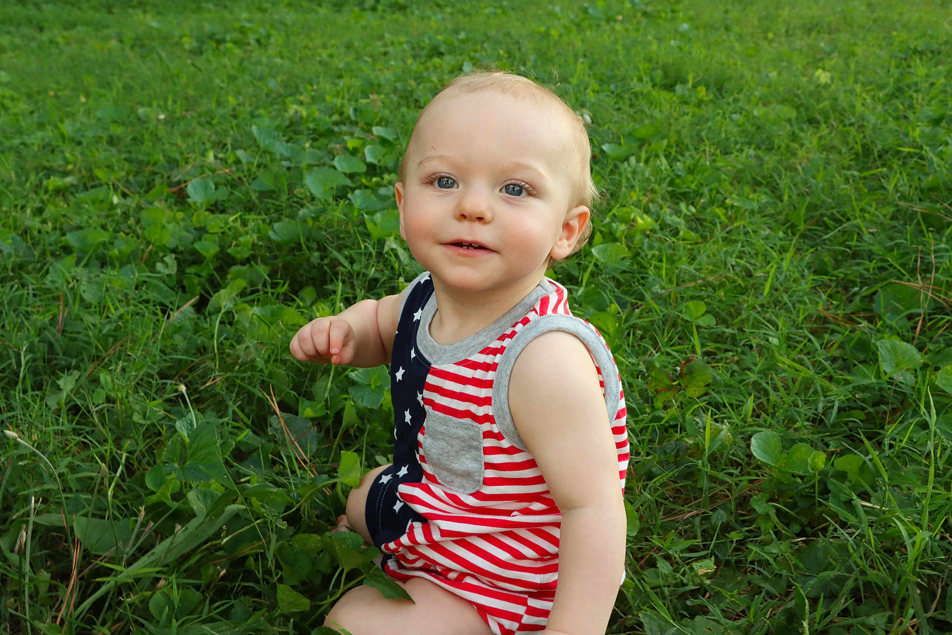 Oaklee joined the competition — help win amazing prizes! toddler, child, grass, outdoor, baby, sitting, smiling, cute, greenery, nature, portrait, young_child, casual_clothing, summer, daylight, innocent, happy, person, face, eyes