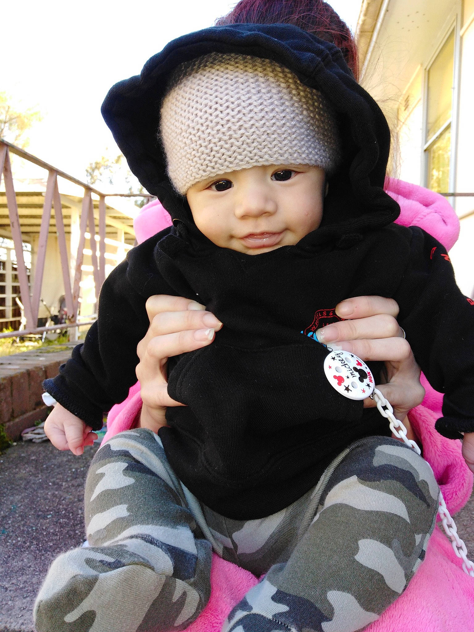 Kyron is registered to the contest to win money with this photo: baby, baby_products, beauty, black_hair, cheek, child, daughter, headgear, knit_cap, outerwear, person, pink, skin, toddler, vacation, winter