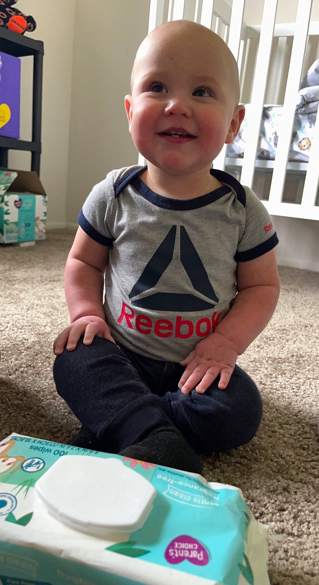 Oakley joined the competition — help win amazing prizes! baby, baby_toddler_clothing, blue, cheek, child, clothing, flooring, fun, grass, green, happy, joy, pattern, person, play, product, sitting, skin, sleeve, smile