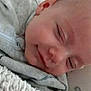 Loric participe au concours pour gagner de l'argent avec cette photo : baby, blanket, close_up, clothing, comfort, cozy, cute, expression, face, head, indoors, infant, nap, peaceful, portrait, resting, skin, sleeping, soft_texture, young_child