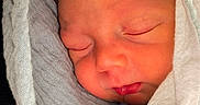 Easton joined the competition — help win amazing prizes! baby, blanket, child, closeup, cozy, cute, face, head, infant, newborn, peaceful, person, portrait, resting, skin, sleeping, soft, swaddled, tiny, wrapped