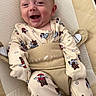 baby, infant, child, smiling, laughing, portrait, seated, baby_seat, harness, pajamas, teddy_bears, patterned_clothing, beige, indoor, cozy, happy, face, playful, close_up, photography