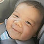 baby, smile, car_seat, infant, child, seatbelt, striped_clothing, closeup, happy, face, head, skin, hair, indoor, person, comfort, transportation, safety, seat, photography