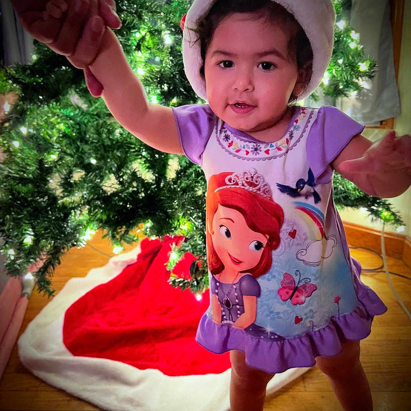 Myla Belle is registered to the contest to win money with this photo: baby, clothing, costume, dress, face, green, hat, head, herbal, herbs, leaf, person, photography, plant, portrait, pottedplant, summer, t_shirt, tree, vegetation