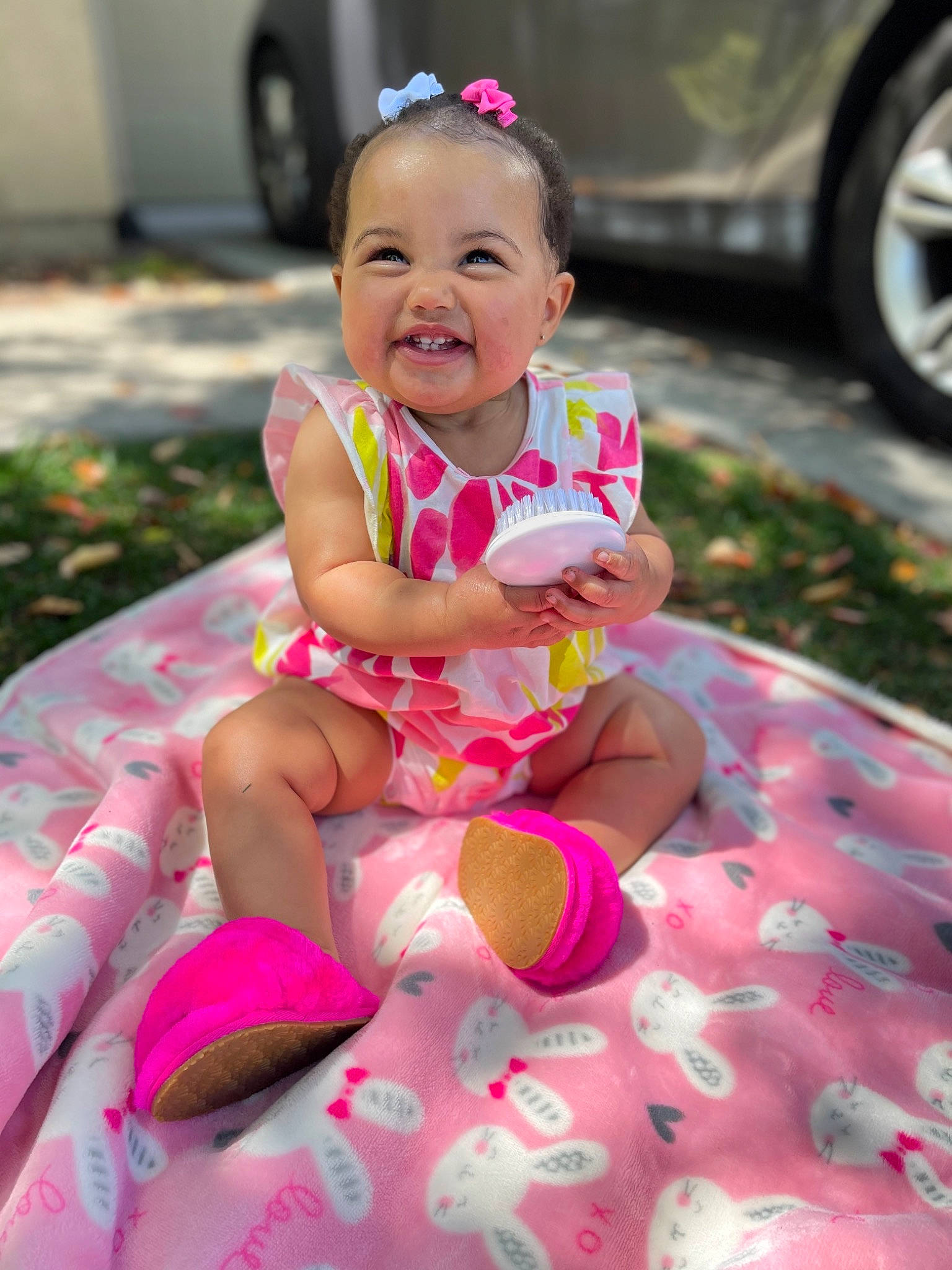 Aunesty is registered to the contest to win money with this photo: baby, baby_toddler_clothing, car, child, dress, eye, face, fun, grass, happy, head, joy, person, pink, shorts, skin, smile, summer, tire, toddler