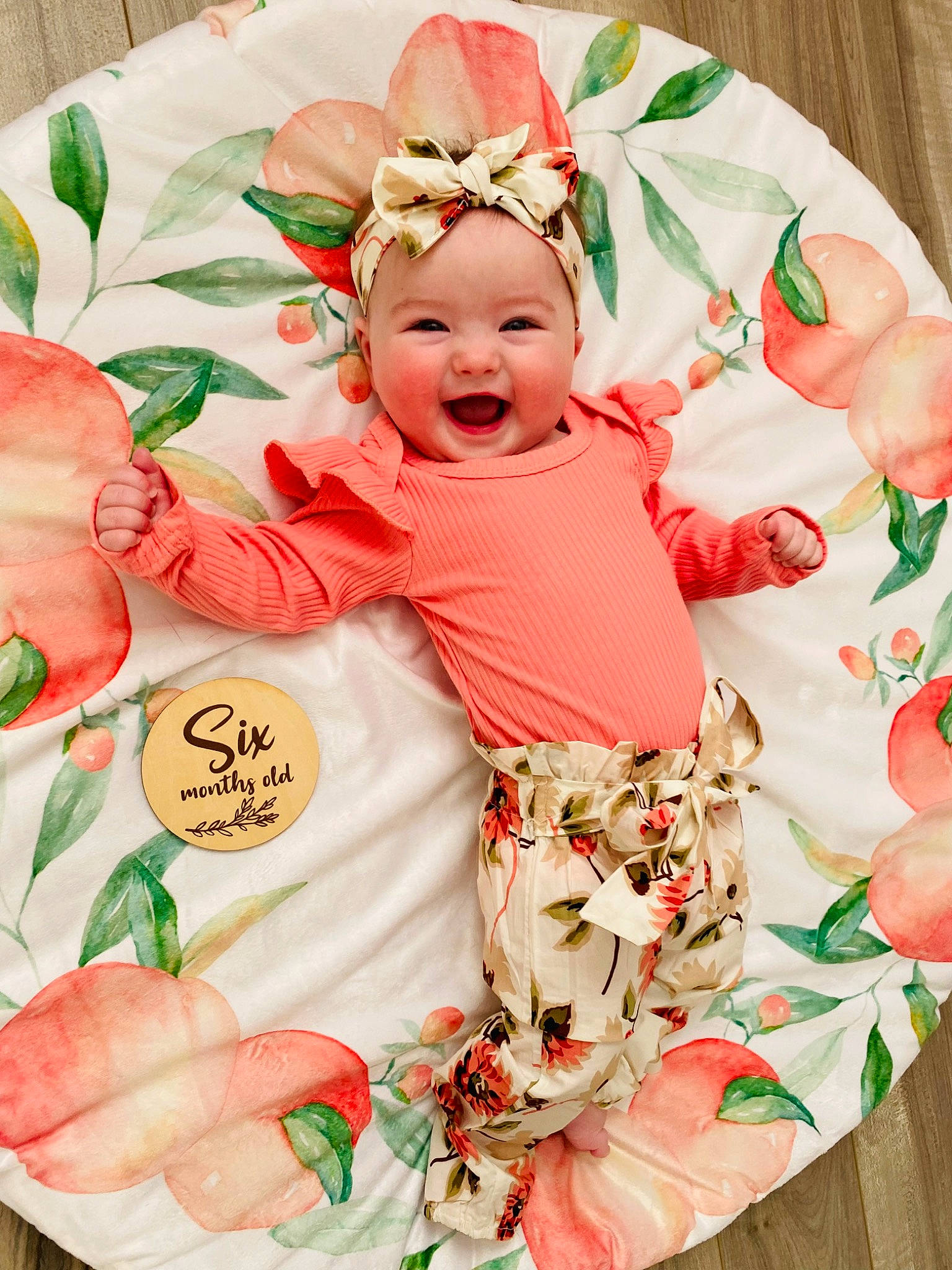 Brielle is registered to the contest to win money with this photo: baby, baby_toddler_clothing, child, event, face, facial_expression, happy, hat, head, headwear, joy, orange, pattern, peach, person, pink, product, skin, sleeve, smile