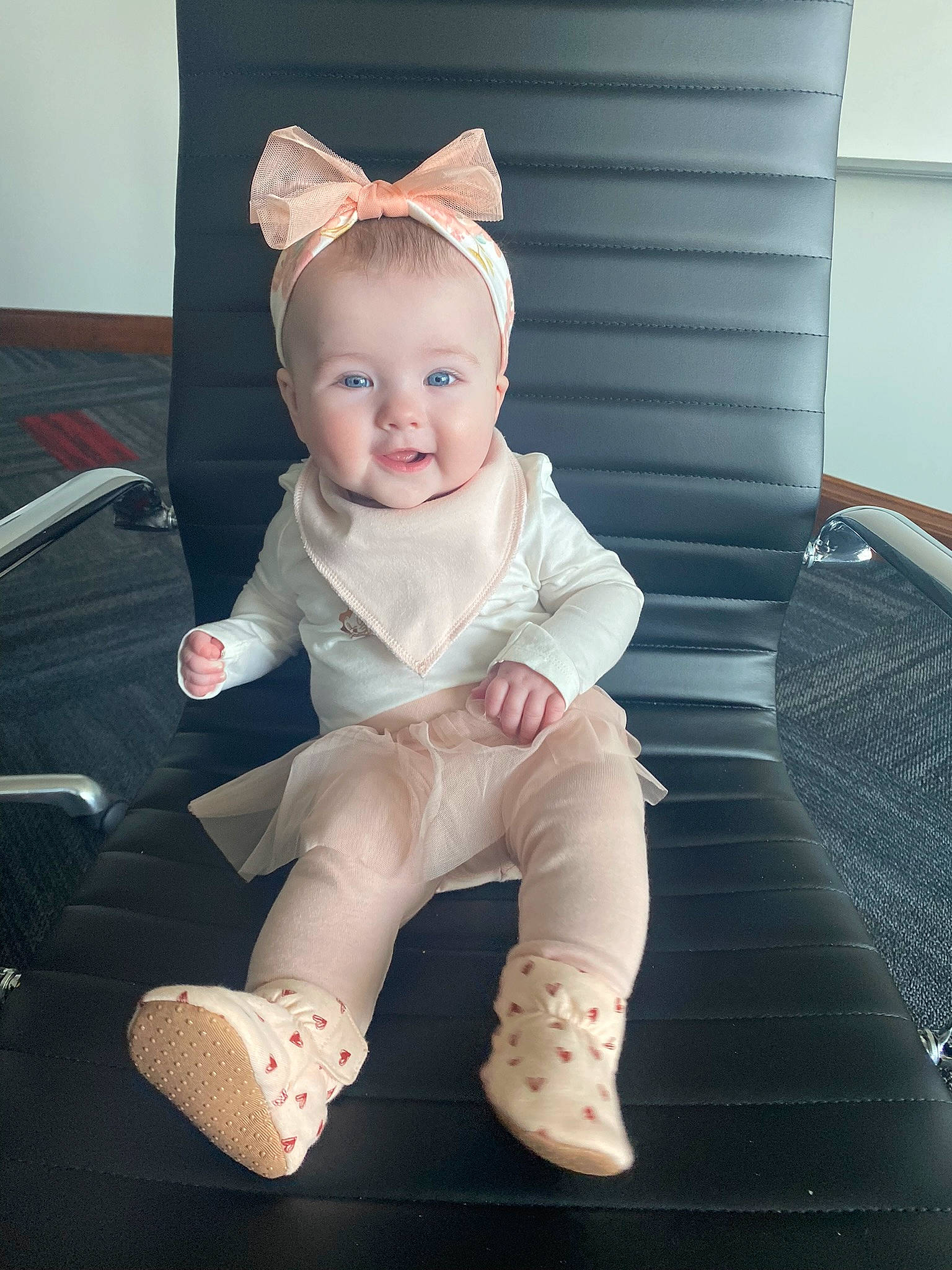 Brielle is registered to the contest to win money with this photo: baby, baby_products, baby_toddler_clothing, chair, cheek, child, comfort, eye, fashion_accessory, foot, happy, human_leg, knee, person, sitting, skin, sleeve, smile, sock, thigh