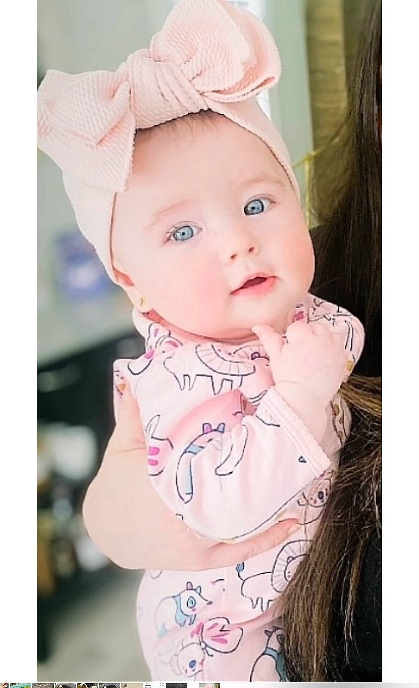 Brielle joined the competition — help win amazing prizes! baby, baby_products, baby_toddler_clothing, cap, cheek, dress, eyelash, face, happy, head, headband, headgear, lip, magenta, pattern, person, pink, product, skin, sleeve