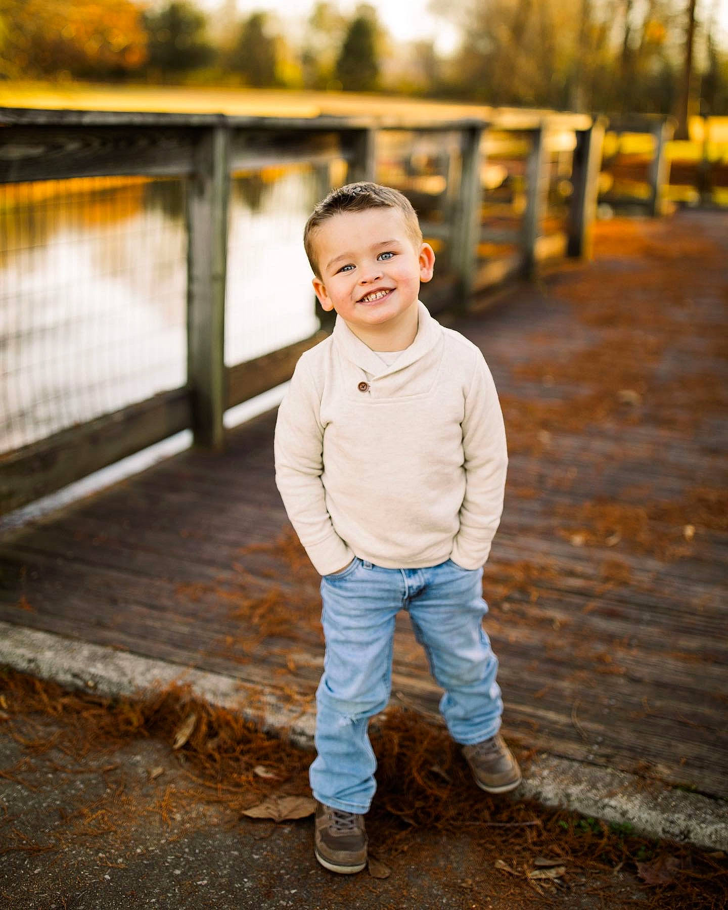 Chandler is registered to the contest to win money with this photo: child, eye, flash_photography, fun, grass, hairstyle, happy, joy, lake, landscape, leaf, leisure, people_in_nature, person, sitting, smile, standing, toddler, tree, water