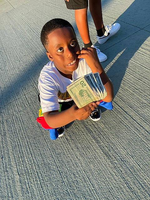 Amarrio is registered to the contest to win money with this photo: asphalt, calf, electric_blue, flooring, fun, happy, human_leg, joint, leg, leisure, person, recreation, road_surface, shoe, shorts, sidewalk, sneakers, street_fashion, thigh, toddler