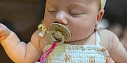 Harper joined the competition — help win amazing prizes! baby, pacifier, headband, sleeping, cute, dress, infant, soft, child, adorable, peaceful, pastel, fabric, tulle, closeup, indoor, person, face, hand, clothing