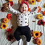 baby, child, autumn, fall, leaves, pumpkins, sunflowers, smiling, headband, onesie, white_blanket, cute, happy, indoors, laying_down, seasonal, decor, portrait, infant, holiday