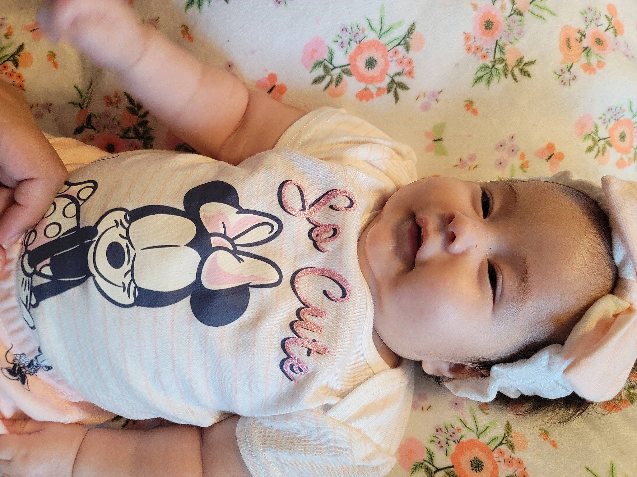 Dahlia is registered to the contest to win money with this photo: baby, baby_toddler_clothing, cheek, child, comfort, elbow, eye, eyelash, happy, head, human_body, human_leg, linens, mouth, nose, person, skin, sleeve, textile, thigh