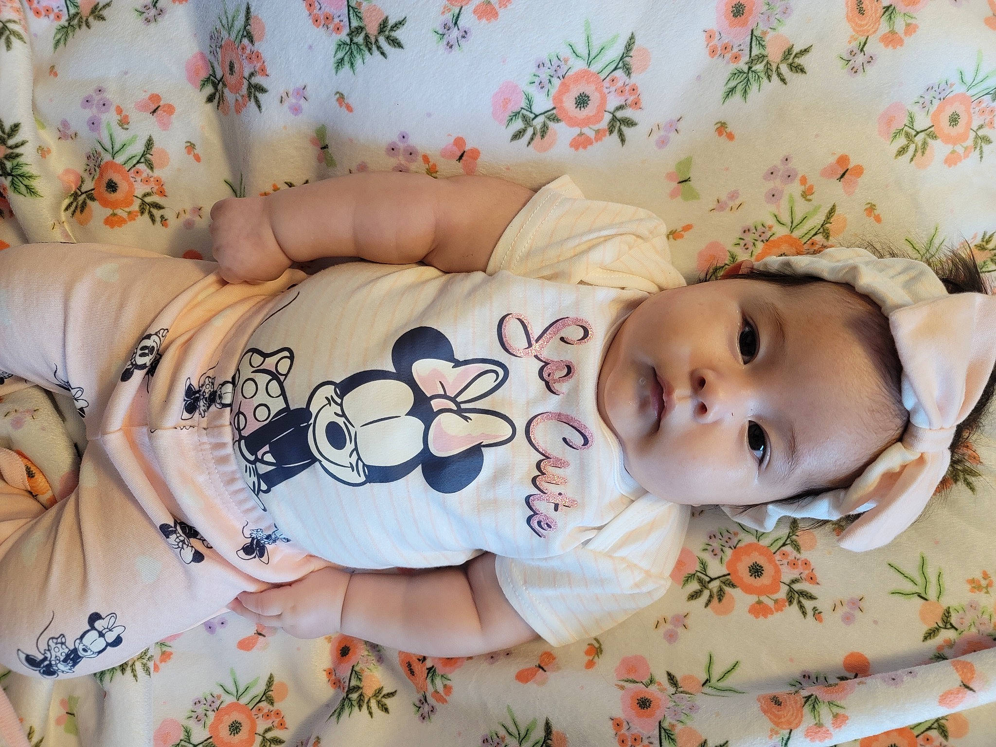 Dahlia is registered to the contest to win money with this photo: arm, baby, baby_toddler_clothing, bedding, cheek, child, comfort, eyelash, face, hand, happy, hat, linens, pattern, person, product, room, skin, sleeve, textile