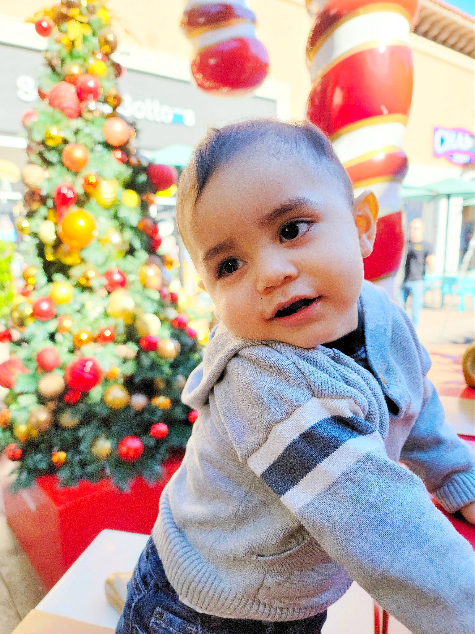 Roman joined the competition — help win amazing prizes! baby, baby_toddler_clothing, child, christmas, christmas_decoration, christmas_ornament, christmas_tree, conifer, event, facial_expression, fun, happy, holiday, holiday_ornament, ornament, person, sleeve, smile, standing, toddler