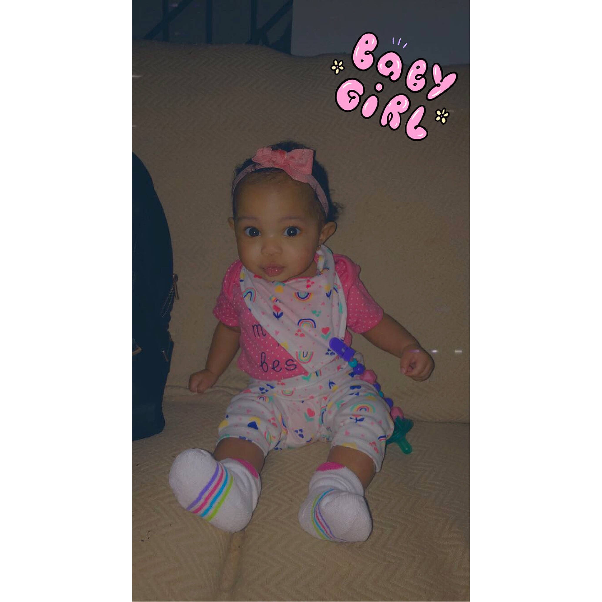 Alaia is registered to the contest to win money with this photo: baby, baby_toddler_clothing, child, circle, electric_blue, face, fashion_accessory, font, happy, magenta, pattern, person, pink, product, sitting, sleeve, t_shirt, toddler