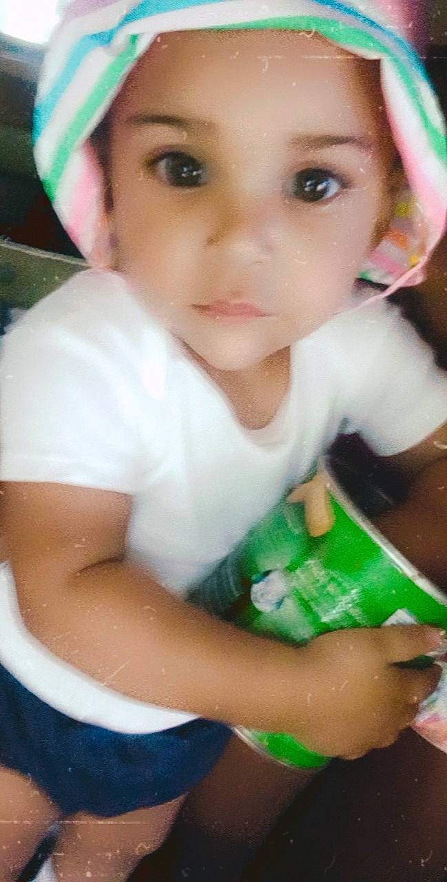 A'Kyra joined the competition — help win amazing prizes! baby_products, bangs, cap, cheek, child, doll, eye, eyelash, fun, grass, happy, iris, lip, nose, organ, person, skin, sun_hat, t_shirt, toddler