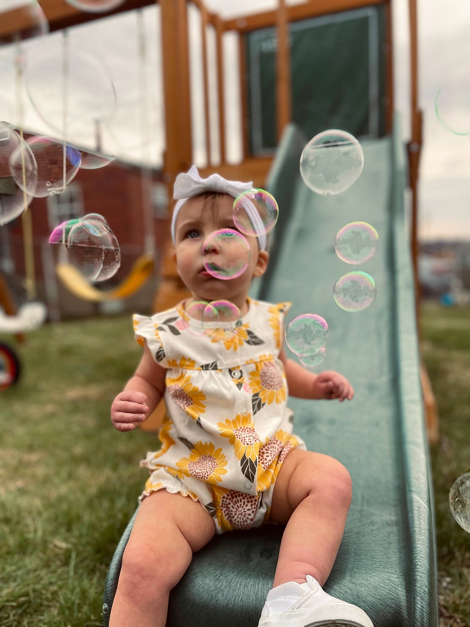Karmyn joined the competition — help win amazing prizes! baby, baby_toddler_clothing, child, city, fun, grass, happy, hat, human_leg, leisure, person, pink, play, public_space, recreation, sandal, sitting, sun_hat, thigh, toddler