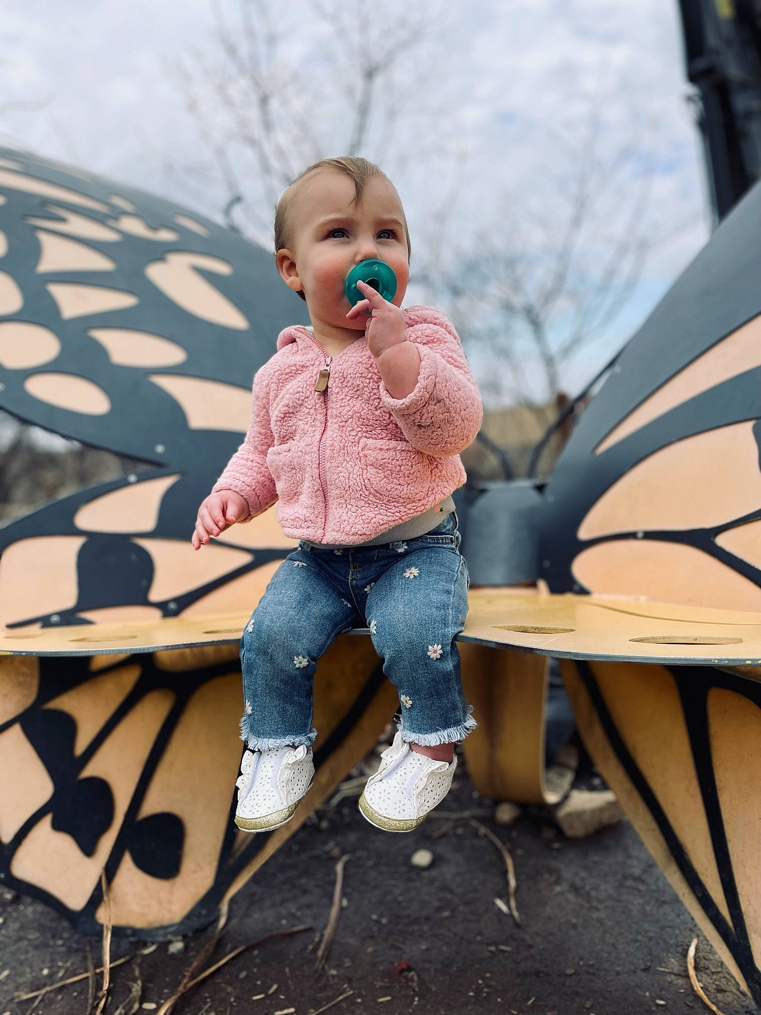 Karmyn is registered to the contest to win money with this photo: baby, child, cool, doll, fun, grass, happy, landscape, leisure, person, public_space, recreation, sandal, sitting, sky, sneakers, textile, toddler, toy, tree