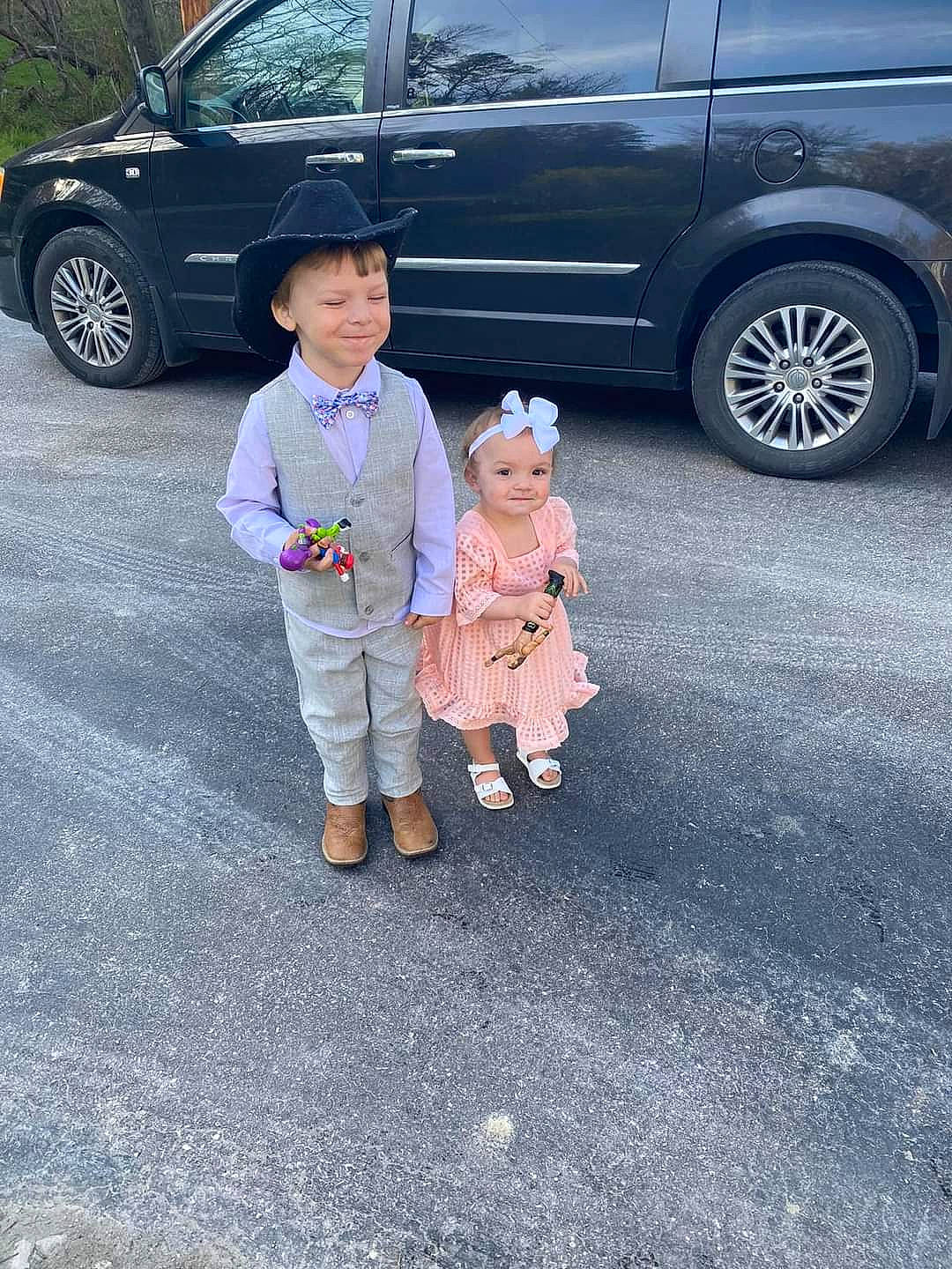 Mason joined the competition — help win amazing prizes! alloy_wheel, asphalt, automotive_design, automotive_exterior, automotive_lighting, automotive_tire, automotive_wheel_system, car, hat, headwear, joy, land_vehicle, mammal, motor_vehicle, person, plant, road_surface, tire, toddler, vehicle