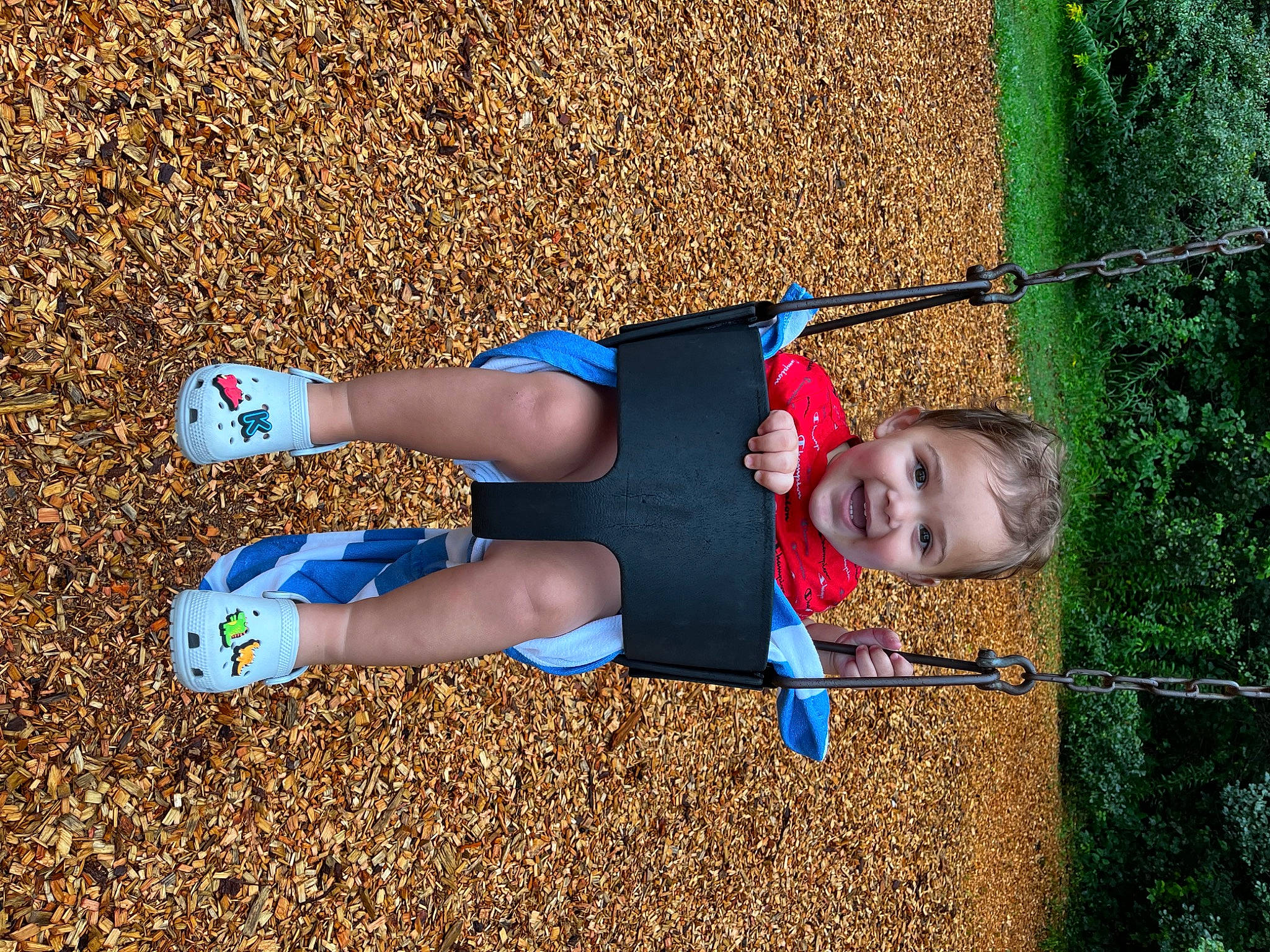 Kaleb is registered to the contest to win money with this photo: calf, child, electric_blue, foot, fun, grass, happy, human_leg, joy, knee, landscape, leisure, outdoor_play_equipment, people_in_nature, person, playground, recreation, sock, soil, thigh