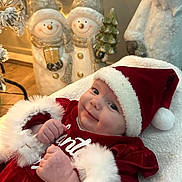 Harper joined the competition — help win amazing prizes! baby, smiling, santa_hat, christmas_outfit, holiday, festive, snowman_decoration, santa_figure, cozy, blanket, indoors, cute, child, portrait, holiday_decor, red_clothing, white_fur, holiday_spirit, festive_season, holiday_cheer