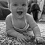 Harper is registered to the contest to win money with this photo: baby, infant, smiling, carpet, indoor, cute, child, face, happy, person, arm, hand, hair, window, curtain, baby_gear, grip, black_and_white, room, crawling