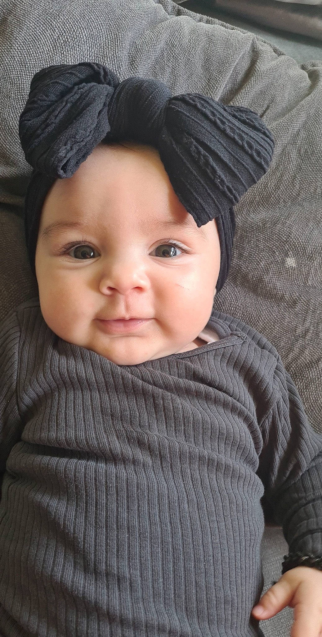 Dayana participe au concours pour gagner de l'argent avec cette photo : baby, cap, cheek, child, eyelash, forehead, happy, hat, headgear, human_body, lip, neck, nose, organ, outerwear, person, skin, sleeve, textile, toddler