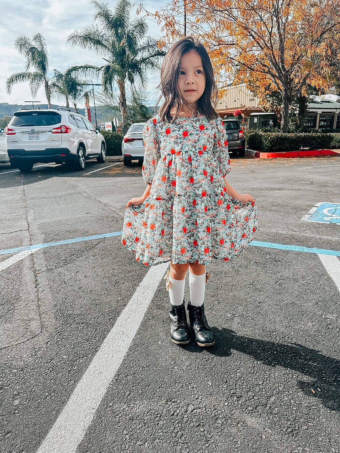 Brighton joined the competition — help win amazing prizes! asphalt, car, dress, electric_blue, fashion_accessory, fashion_design, human_leg, knee, pattern, person, plant, recreation, road, road_surface, sidewalk, sky, sleeve, street, tree, waist