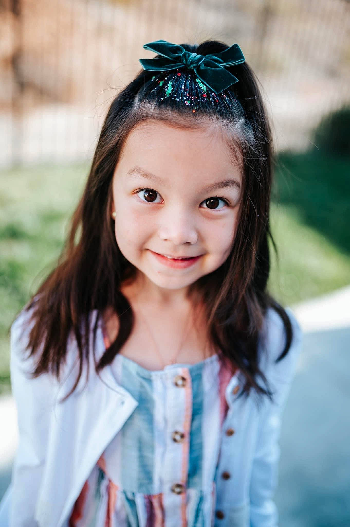 Brighton is registered to the contest to win money with this photo: beauty, child, dress, electric_blue, eyelash, flash_photography, fun, goggles, grass, happy, headband, headpiece, iris, jewellery, joy, person, personal_protective_equipment, plant, smile, toddler