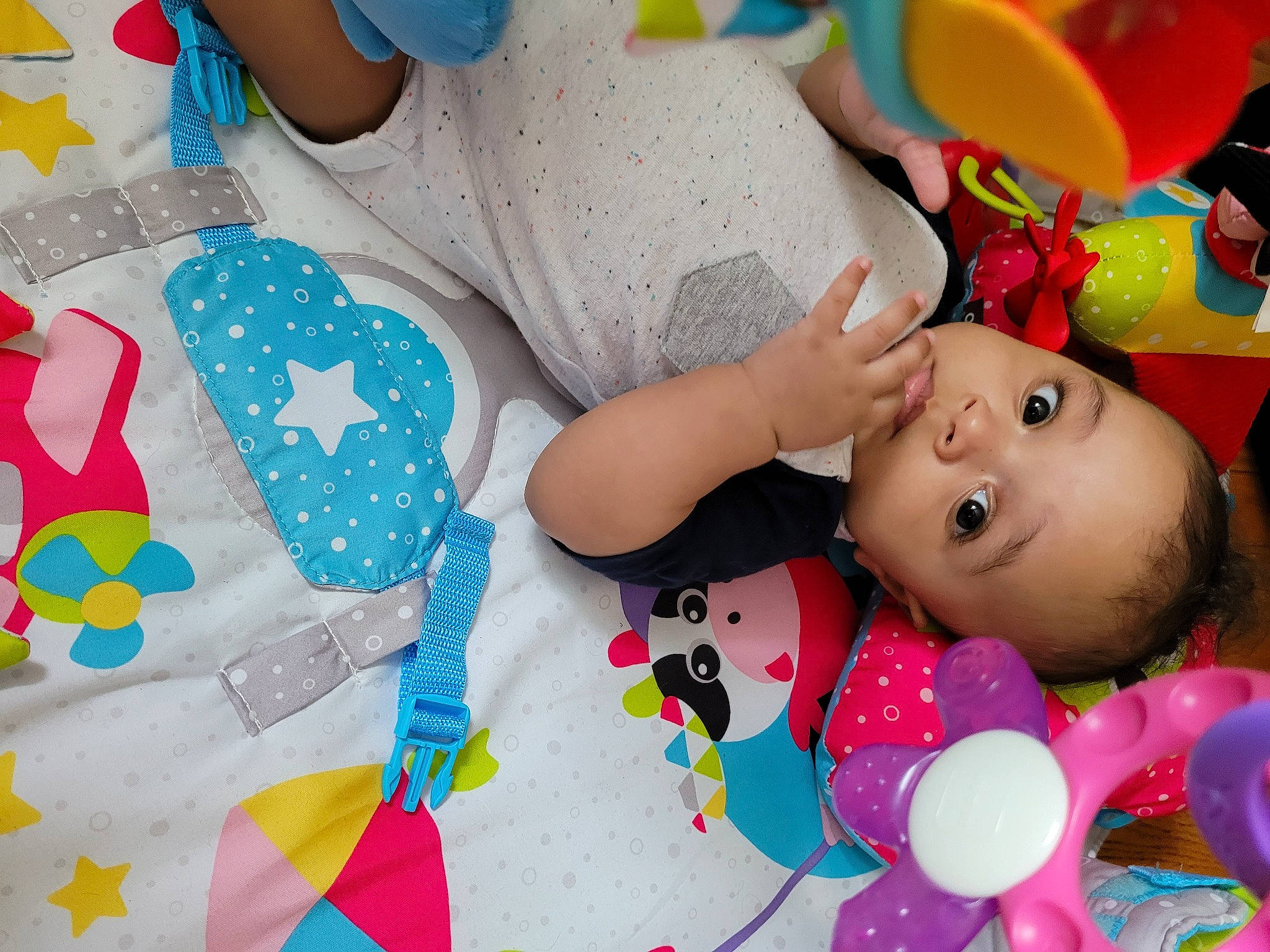 Emmanuel is registered to the contest to win money with this photo: baby, baby_playing_with_toys, baby_products, baby_toddler_clothing, cheek, child, design, fun, green, happy, leisure, linens, pattern, person, photograph, pink, product, textile, toddler, toy