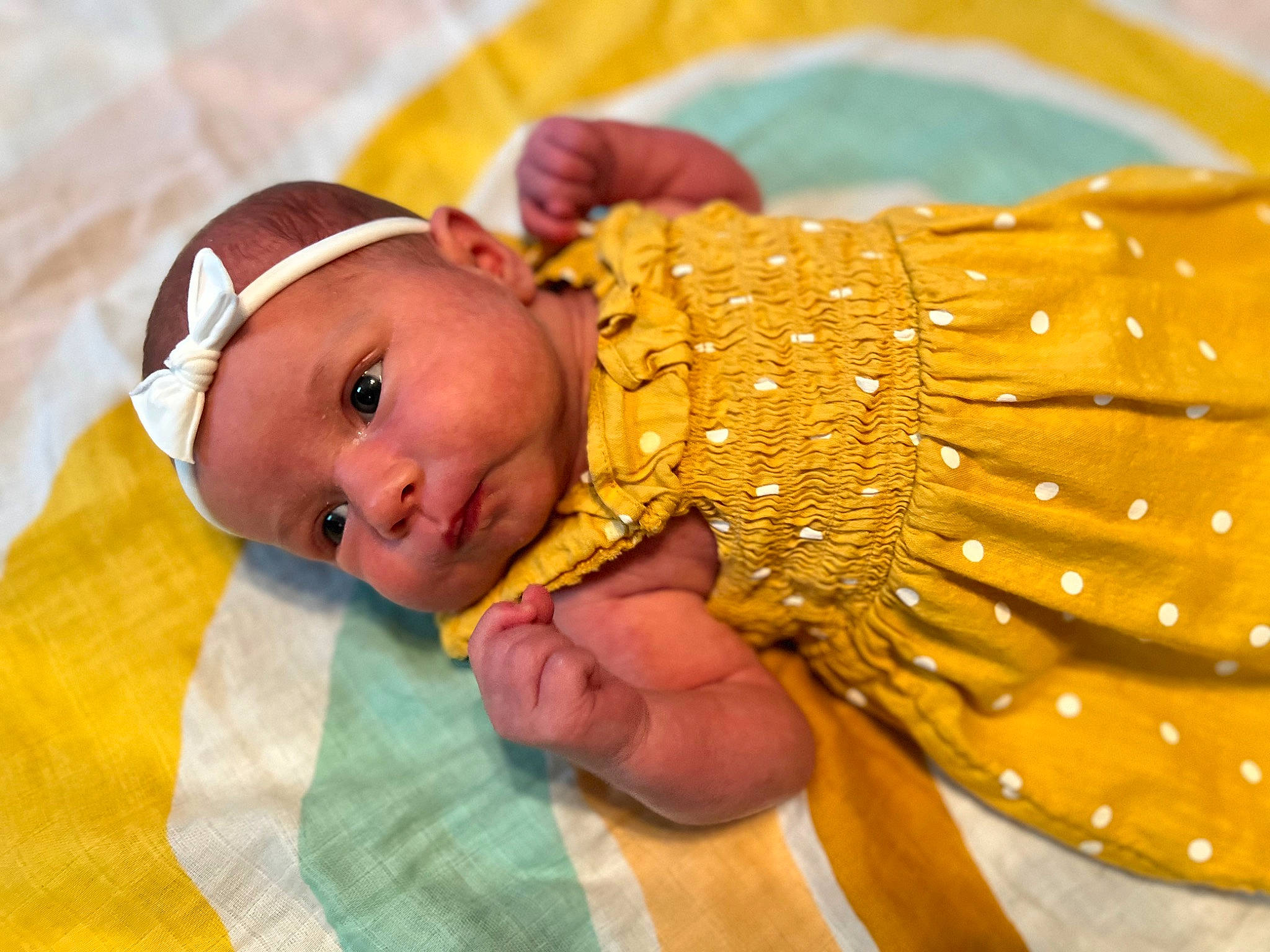 Emersyn is registered to the contest to win money with this photo: abdomen, baby, baby_toddler_clothing, child, close_up, comfort, event, fashion_accessory, finger, fun, gesture, happy, headwear, jewellery, metal, nail, pattern, person, textile, toddler