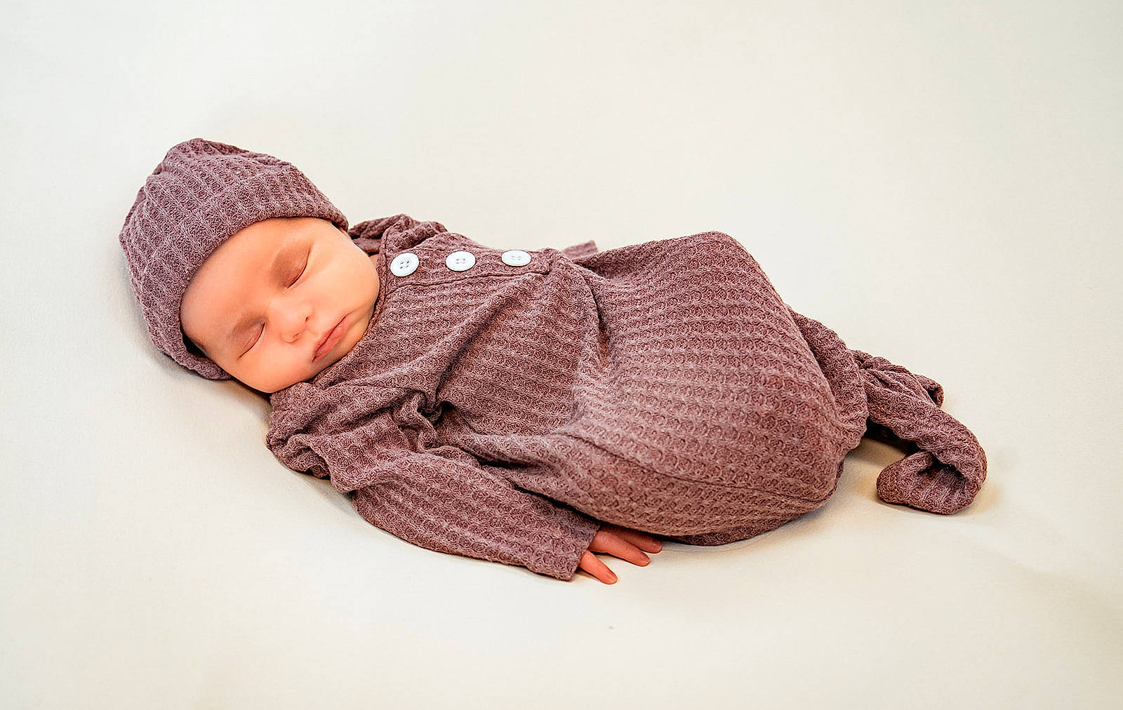 Emersyn joined the competition — help win amazing prizes! baby, baby_sleeping, baby_toddler_clothing, beanie, cap, child, comfort, crochet, fashion_accessory, flooring, headgear, headwear, knit_cap, linens, magenta, pattern, person, sitting, sleeve, toddler