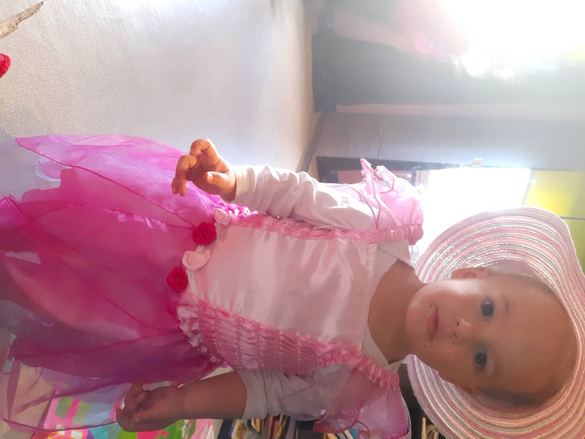 Amara participe au concours pour gagner de l'argent avec cette photo : baby, baby_toddler_clothing, child, comfort, event, fun, happy, hat, leisure, magenta, person, pink, room, sun_hat, toddler
