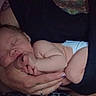 Freyja joined the competition — help win amazing prizes! adult, arm, baby, care, closeup, comfort, dark, diaper, fabric, hand, holding, infant, newborn, person, portrait, quiet, rest, skin, sleeping, tender