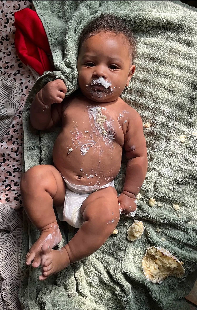 Liam Alexander is registered to the contest to win money with this photo: abdomen, baby, barechested, chest, fun, happy, head, human_leg, jewellery, muscle, navel, neck, necklace, person, shorts, sitting, skin, stomach, thigh, toddler