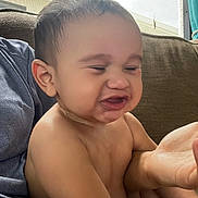 Josai joined the competition — help win amazing prizes! baby, child, face, expression, funny_face, skin, hand, couch, indoor, person, portrait, wet, hair, sitting, adult_hand, home, closeup, cute, infant, reaction