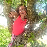 Morganne participe au concours pour gagner de l'argent avec cette photo : child, glasses, tree, pink_tank_top, camouflage_pants, outdoor, green_leaves, sunlight, playful, nature, grass, shoes, happy, person, summer, daylight, casual_clothing, young, fun, smiling