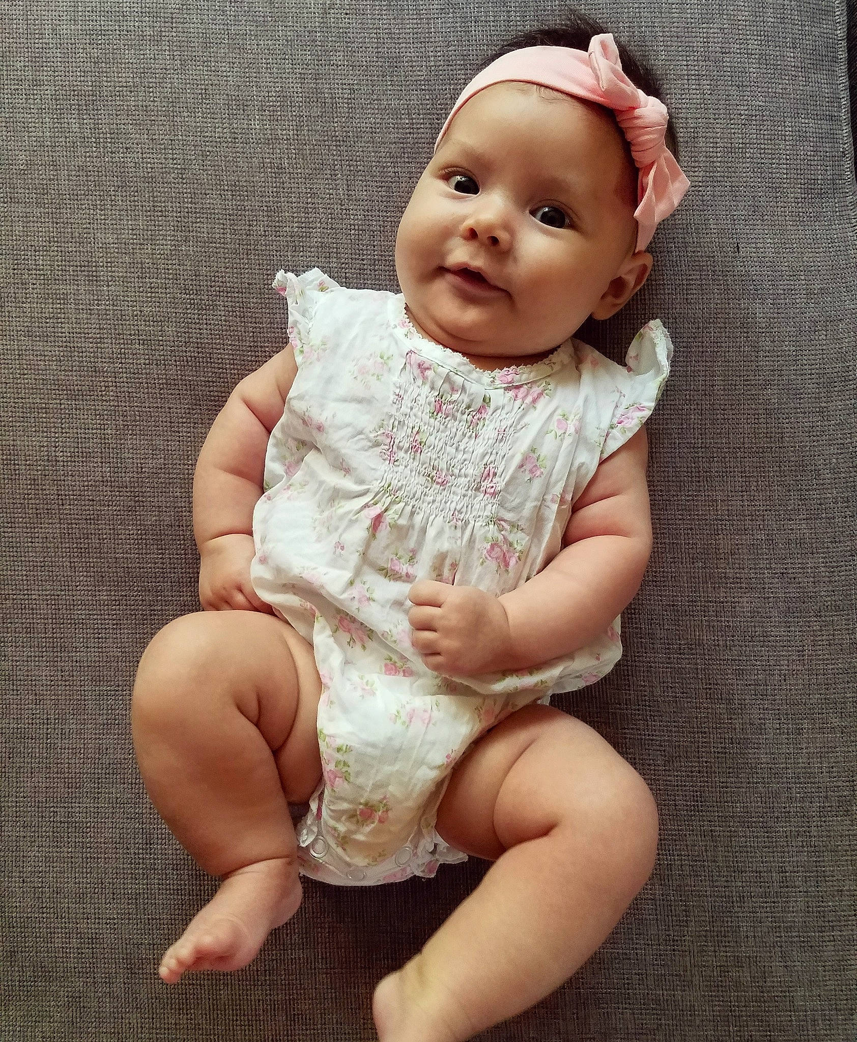 Luna-rose is registered to the contest to win money with this photo: arm, baby, baby_toddler_clothing, beauty, cheek, child, dress, eye, face, hand, head, headgear, leg, lip, nose, person, pink, sitting, skin, smile