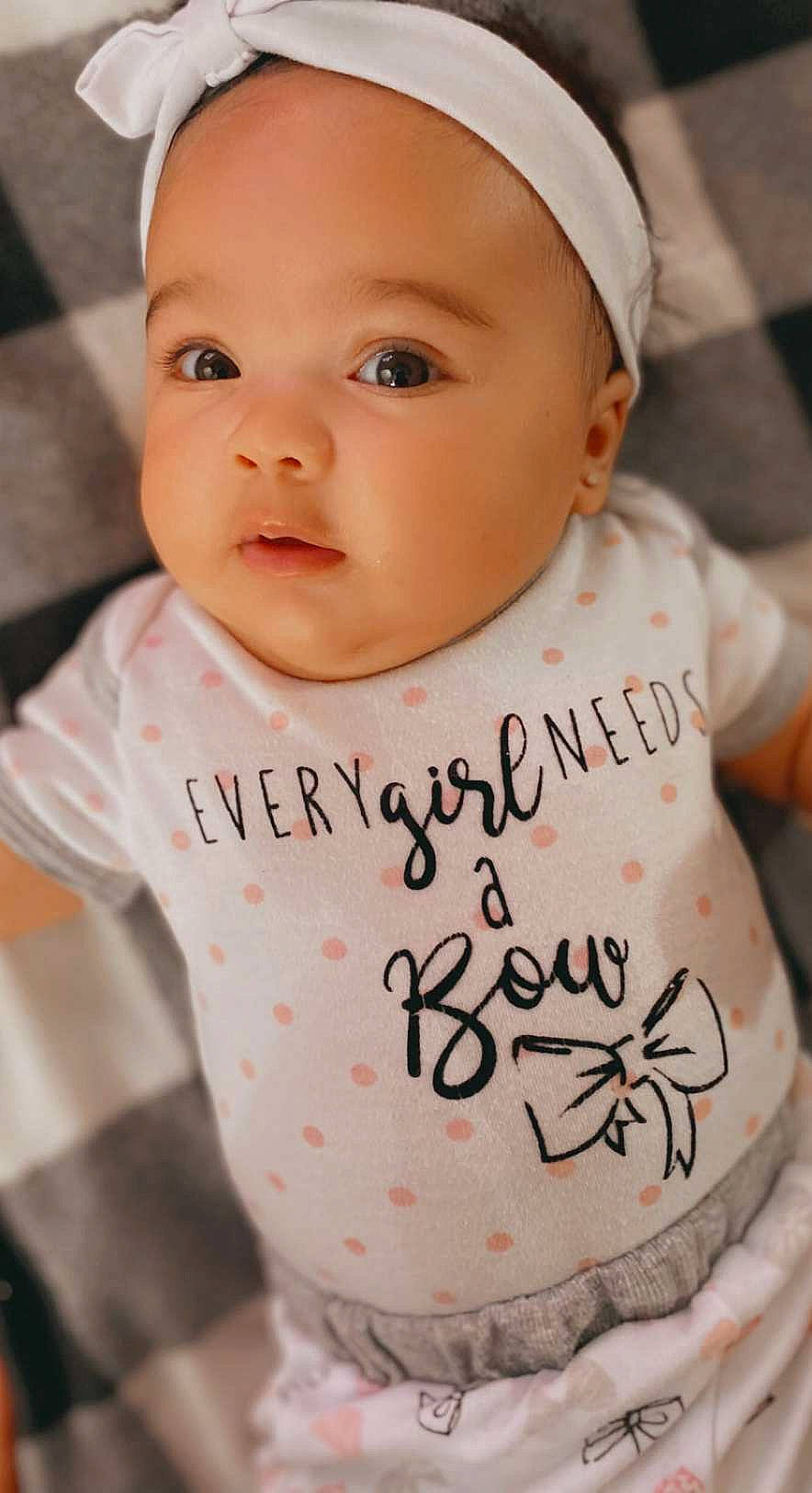 Maila joined the competition — help win amazing prizes! baby, baby_toddler_clothing, cap, cheek, chin, eye, eyebrow, face, facial_expression, finger, hairstyle, happy, human, lip, neck, person, pink, skin, sleeve, smile