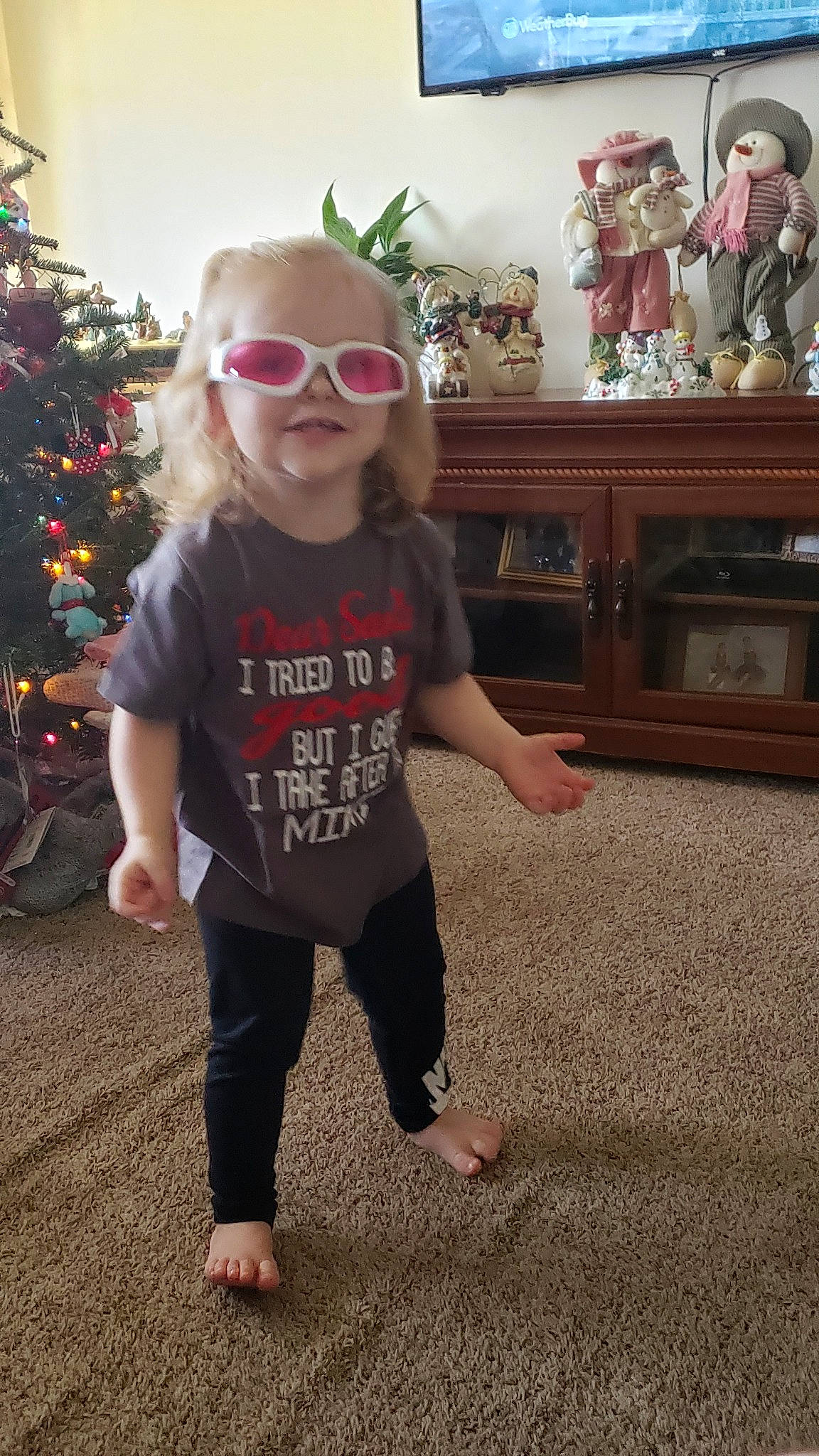 Parker joined the competition — help win amazing prizes! child, christmas, christmas_tree, cool, eyewear, fun, glasses, holiday, outerwear, person, sleeve, smile, standing, t_shirt, toddler, top, tree