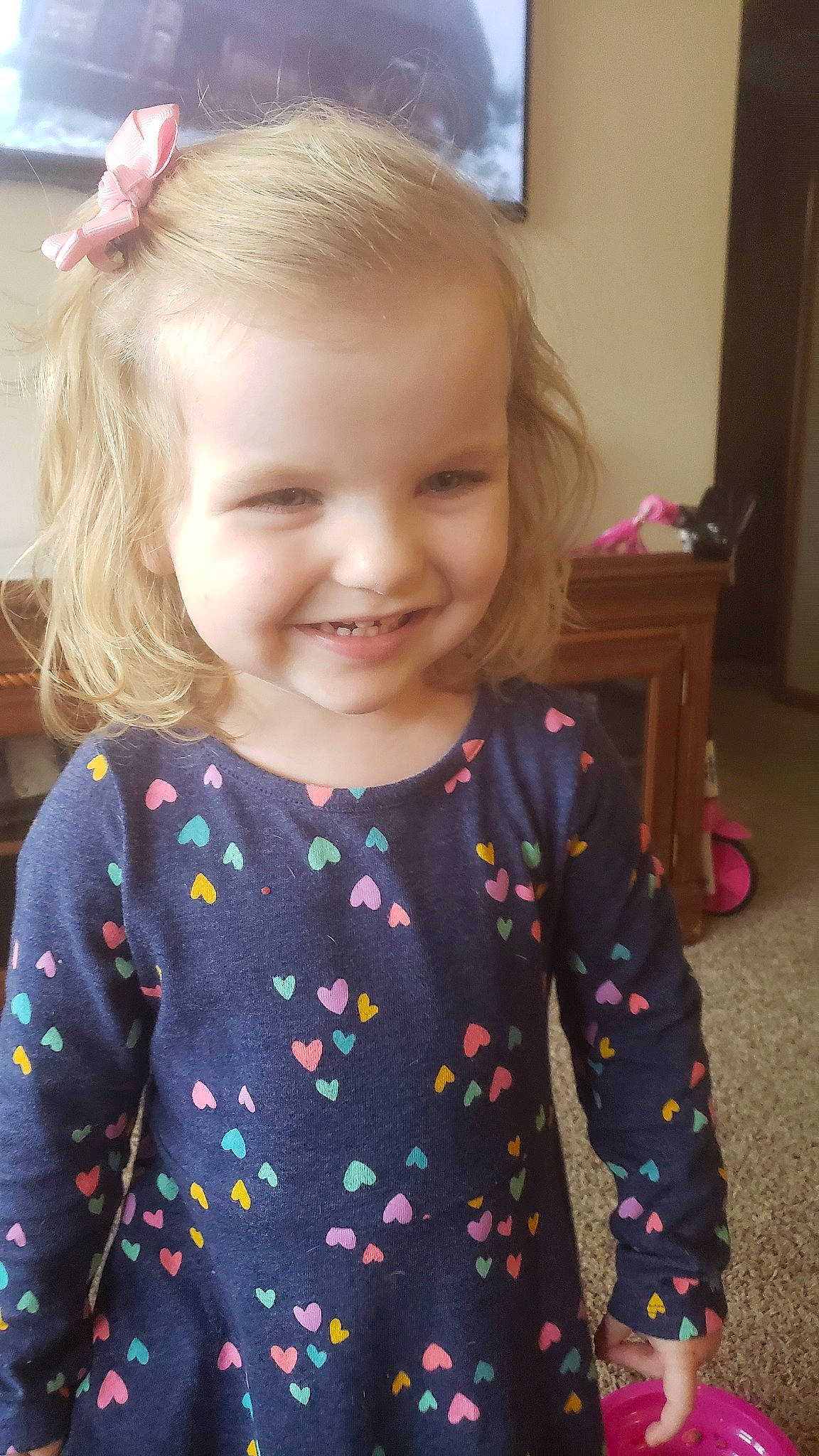 Parker joined the competition — help win amazing prizes! baby, blond, cheek, child, design, dress, face, hair, hairstyle, head, iris, joy, outerwear, pattern, person, pink, skin, sleeve, smile, sweater