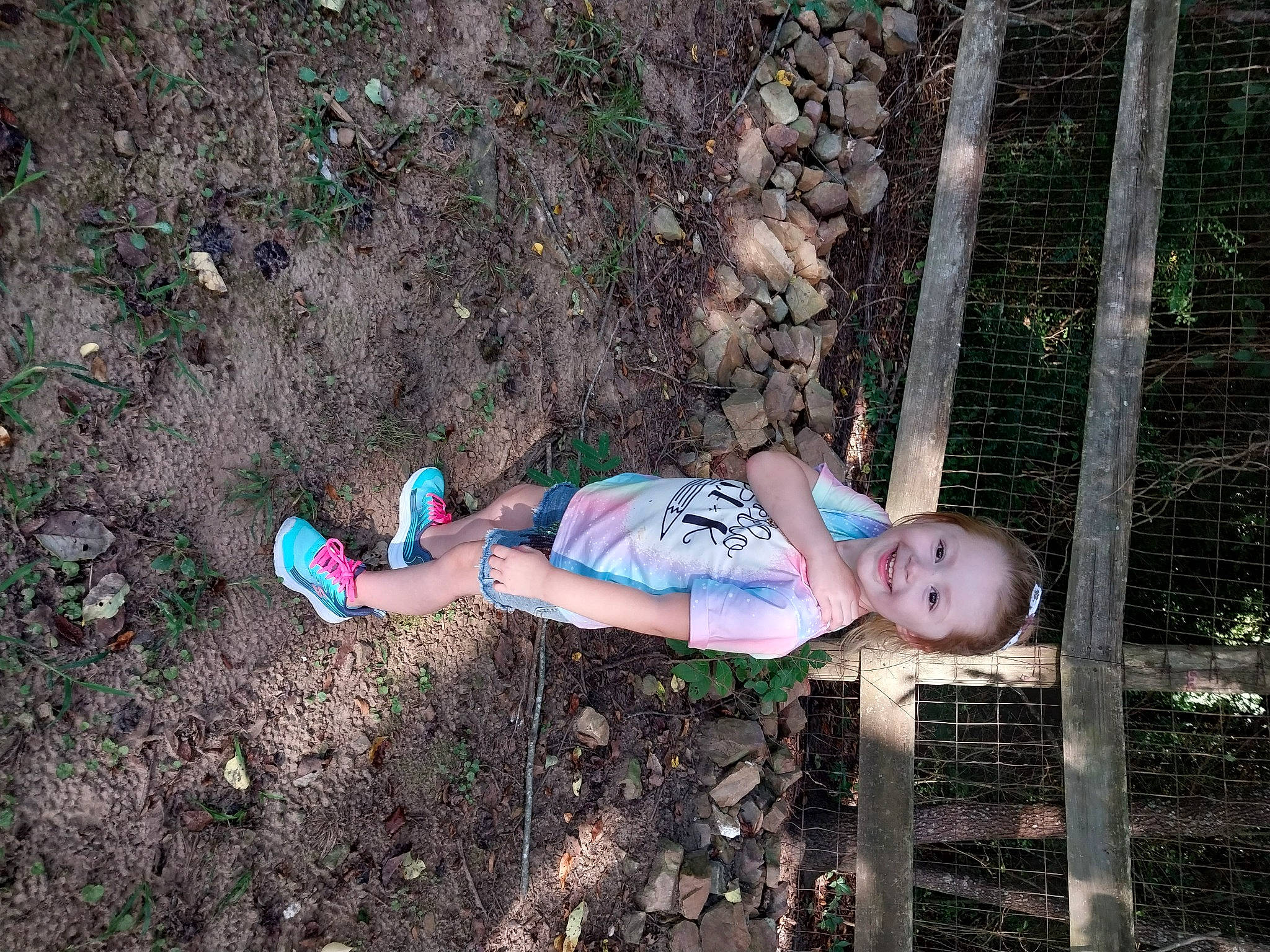 Kendalyn is registered to the contest to win money with this photo: baby, baby_toddler_clothing, child, electric_blue, fence, fun, grass, human_leg, joy, leisure, people_in_nature, person, plant, soil, thigh, toddler, tree, wood